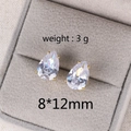 Macro shot of 8x12mm teardrop zircon earrings in gold bezel set on velvet - 12MM Water Drop Gold