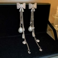 Detail of silver bow earrings with long tassels, rhinestones, and hanging drop pearls - Silver Pave Zirconia Bowknot Pearl Long Tassel Earrings (12# Silver Needle - Silver)