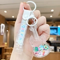 Guitar-shaped floating liquid keychain with avocado sequins and a colorful wrist strap - Fruit Violin - Mixed Fruit