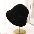 Detail of black crochet knit sun hat showing breathable hollow pattern on a metal stand - M (56-58cm) / Black