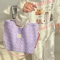 Detail of purple quilted heart crossbody bag with adjustable strap and brand label - Purple Heart