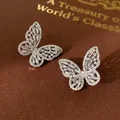 Sparkling silver butterfly stud earrings with marquise cubic zirconia on leather background - Hollow Zircon Butterfly Stud Earrings