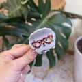 Close-up of cute white puppy hair claw clip made of acetate with brown glasses detail - Heart Eyeglasses Gray Puppy