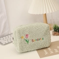 Detail of green plush makeup bag with pink tulip embroidery and Sunshine text - Light Green