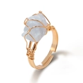 Adjustable wire wrapped ring with irregular light blue raw stone in golden finish - Aquamarine