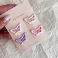 Detail view of four butterfly-shaped hair clips in pastel pink and purple colors - 8# Pink Purple Butterfly Set