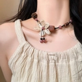 Detail of bohemian necklace featuring white woven flower pendant and natural wood beads - Wood Bead Raffia Flower Pendant (24#)