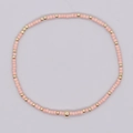 Pulsera bohemia hecha a mano con cuentas cilíndricas rosa claro y esferas de cobre dorado - Cuentas Redondas Planas Rosa Oro