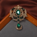 Baroque vintage gold brooch with emerald green stone and crystal accents on silk fabric - Style 8 (Emerald + Antique Gold)