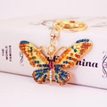 Colorful crystal butterfly keychain in gold finish with blue and orange rhinestones - Peacock Blue Colorful
