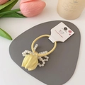 Yellow tulip hair tie with white faux pearls and fabric flower on grey background - Yellow Tulip Hair Tie