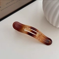 Elegant tortoiseshell brown gradient matte hair clip shown on minimalist white table - Duckbill Clip - Amber