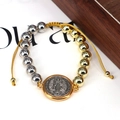 Detail of bicolored gold and silver beads with Saint Benedict medal on adjustable rope - Gold