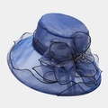Elegant French organza dress hat with large flower decoration and mesh texture. - Blue