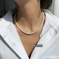 Detailed view of 6mm pearl necklace on model showing 14K gold plated pendant luster - 31# Gold White 6mm Pearl Necklace