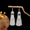Ethnic style silver tassel earrings with hollow flower design on a dark background - Ethnic Hollow Flower Tubular Tassel Style (E2871-4)