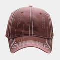 Detailed view of brown washed distressed baseball cap with white contrast stitching detail - Coffee