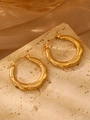 Golden twisted rope texture hoop earrings in stainless steel on stone background - 18K Gold Patterned (0855)