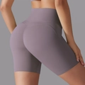 Detailed back view of high-waisted seamless lilac yoga shorts with butt lifting effect - Mulberry Purple