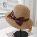 Detail of UV-protected sun hat featuring fine weaving and elegant brown satin bow - Camel + Wine Red Bow