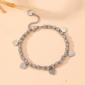 Detailed shot of textured bead bracelet with silver heart charms and pavé crystal accents - Silver Bracelet / Silver