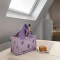 Detail of purple canvas lunch bag featuring floral embroidery and woven brand label - Purple Butterfly