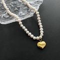 Elegant natural baroque pearl necklace with a polished gold heart pendant on glass - 04-G8 Titanium Steel Natural Heart Pearl Necklace Gold