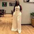 Women's sleeveless beige wide-leg jumpsuit featuring large decorative wood buttons - S / Off White