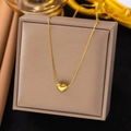 Minimalist gold heart pendant necklace for women displayed on a luxury jewelry box - Mini Heart (AH398) / Gold