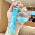Blue fairy tales themed bear keychain with heart shaped bottle and liquid floating beads - Letter Bead Perfume Bottle - Blue