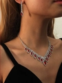 Silver bridal jewelry set featuring red teardrop gemstones and sparkling rhinestones - Red