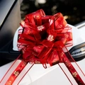 Detail of red macaron pull flower ribbon with gold double happiness logo on car mirror - 10 Strands Pack / Double Joy Red