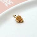 Detailed macro view of a gold pine cone pendant with scales for DIY jewelry making - 10# Pinecone 3