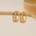 Close-up of geometric V-shaped gold earrings with paved white cubic zirconia crystals - EH410031-Gold Geometric Cross