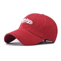 Close-up of red cotton baseball cap featuring white 3D Vintage script embroidery - Adjustable / Red