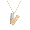 Two-tone gold and silver letter V pendant necklace with unique lava textured surface - Letter V