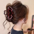 Pink and burgundy layered heart hair claw clip shown on woman's hair in a daily style - Hollow Triple Red Pink Hearts