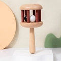 Wooden baby rattle with three colorful rolling balls on a minimalist white stage - Carbonized Beech Hand Rattle (3 Beads)