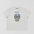Macro detail of the metal-texture skull graphic and logo on a white oversized t-shirt - S / Cloud White