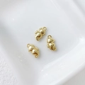 Detailed macro view of three 14k gold-plated seahorse pendants on white ceramic - 3# Seahorse