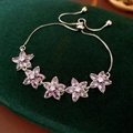 Detailed view of adjustable purple zircon flower bracelet with elegant silver-plated sliding clasp - Purple Silver