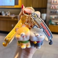 Cartoon Shiba Inu Pärchen Schlüsselanhänger in Orange und Grau mit Silikon Handschlaufen - Shiba Inu Paar / Orange/Grau