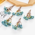 Detail of DIY artificial flower spray with blue petals and pink buds for crafts - Blue