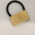 Golden textured metal hair tie with black elastic band in a minimalist Korean style - Curved Small Spike Gold