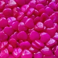 Polished 2cm rose quartz heart stones stacked with smooth translucent finish - Rose Pink Jade