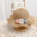 Macro detail of straw hat with three fabric flowers, pearls, and wavy hollow edge - Straw Hat / Khaki / 52cm (2-5 Years)