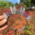 Detail of handmade crystal moon headband featuring gradient stones and ornate metalwork - White Red Blue Crystal with Triple Moon