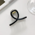 Close-up of black and grey striped hair claw clip with a durable gold metal spring - F-Grey and Black Patchwork
