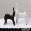Modern black and white ceramic horse statues for minimalist home and office decor - Big White And Little Black Abstract Horse Combination