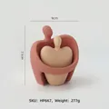 Modern abstract couple ceramic figurine in reddish-brown and beige matte finish - Hugging Style Couple Set